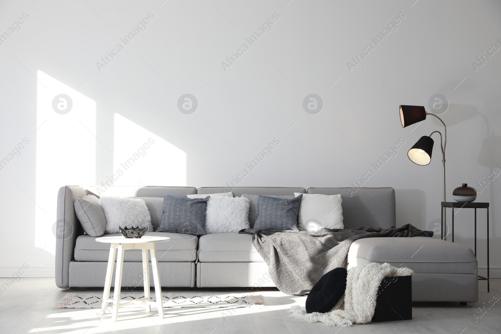 Photo of Stylish living room interior with comfortable sofa