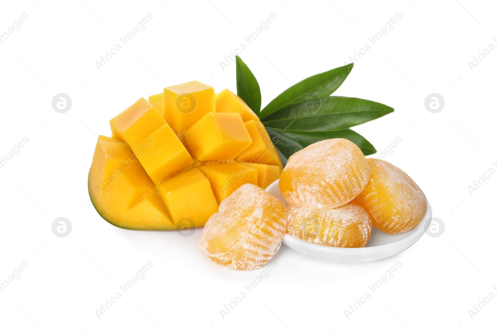 Photo of Delicious mochi with green leaves and mango on white background. Traditional Japanese dessert