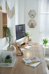 Photo of Stylish home office interior with comfortable workplace