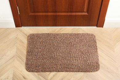 Photo of New clean rectangle mat near entrance door