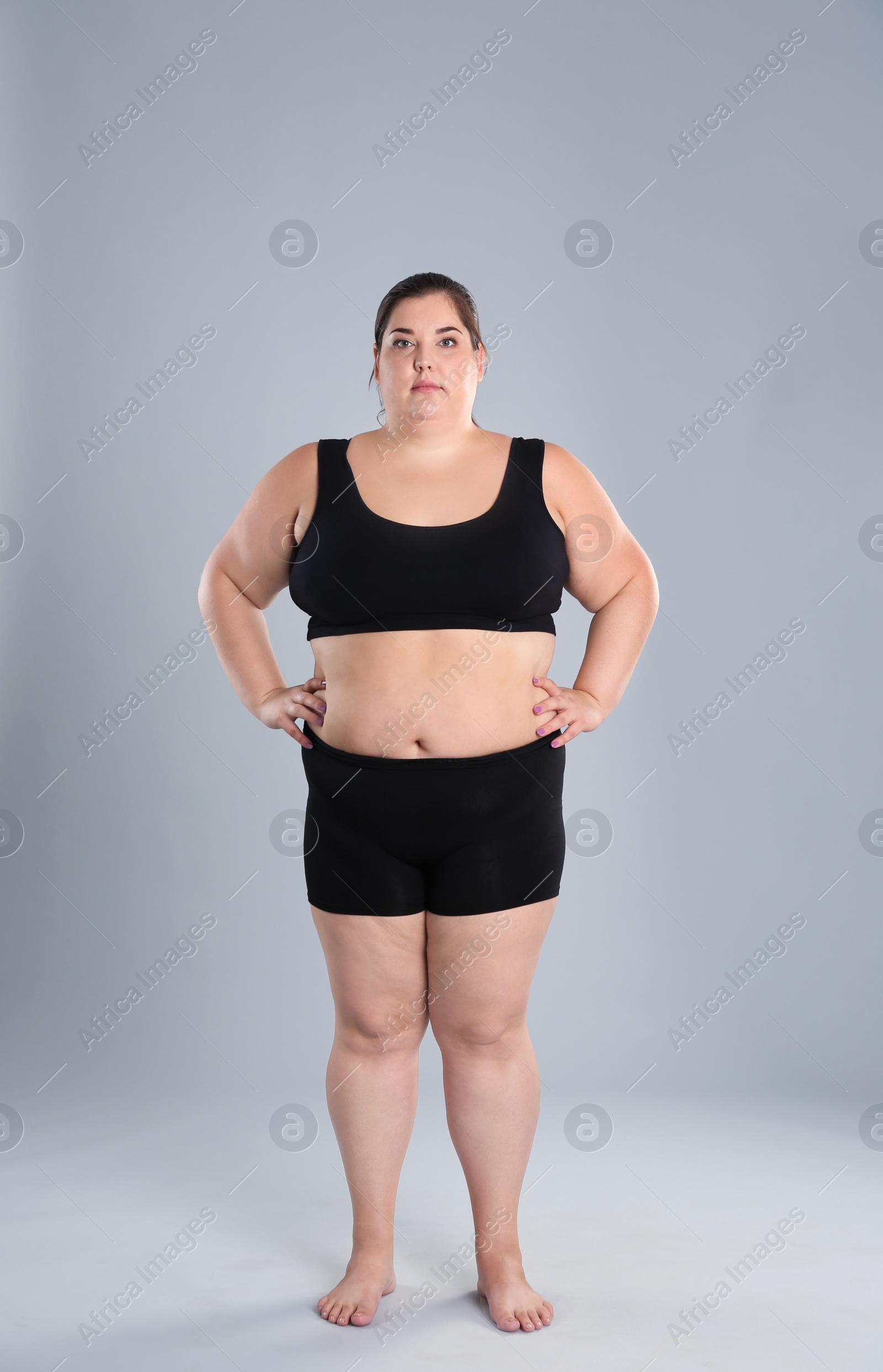 Photo of Overweight woman before weight loss on color background