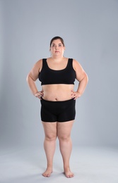 Overweight woman before weight loss on color background