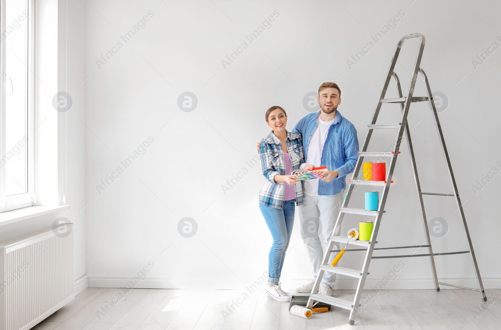 Photo of Young couple with color palette indoors