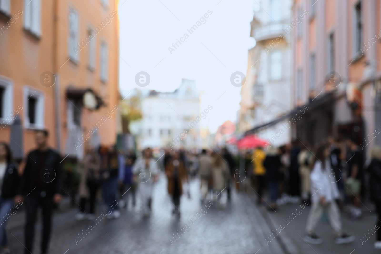 Photo of Blurred view of people walking on city street