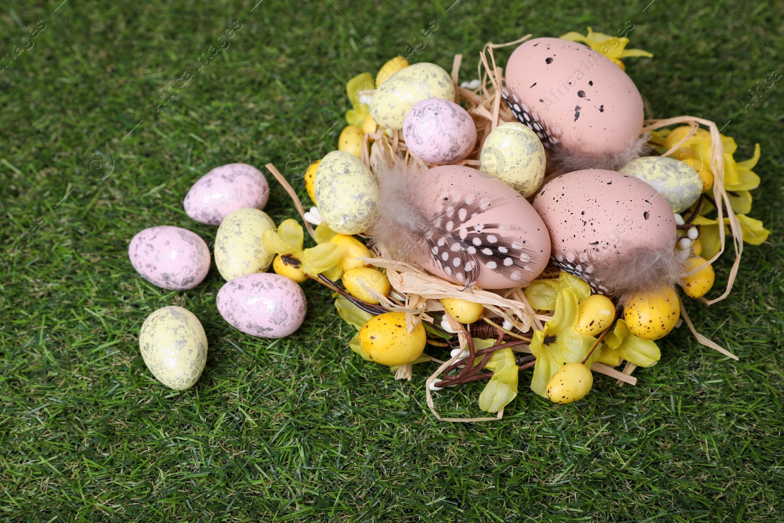 Photo of Festively decorated Easter eggs on green grass