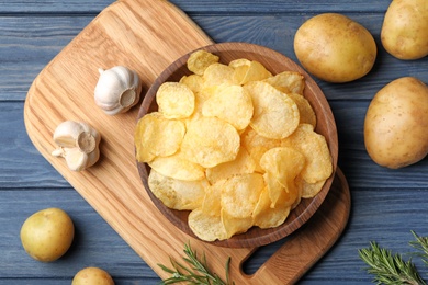 Photo of Flat lay composition with potato chips on table