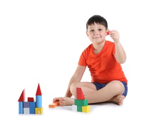 Photo of Cute child playing with colorful blocks on white background