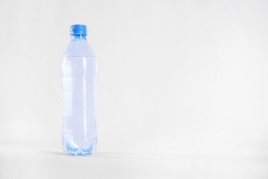 Photo of Plastic bottle with pure water isolated on white