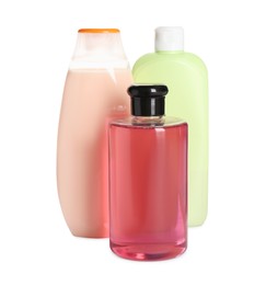 Photo of Different shower gel bottles on white background