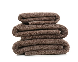 Photo of Stack of clean folded towels on white background