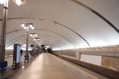 Photo of Spacious subway station with sitting places. Public transport