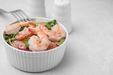 Delicious salad with pomelo, shrimps and tomatoes on white table, closeup. Space for text