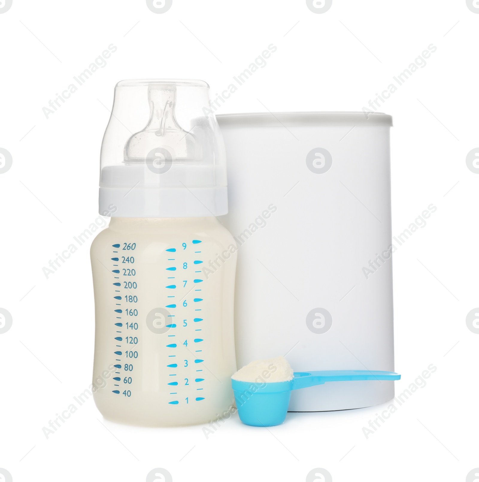 Photo of Blank can of powdered infant formula with feeding bottle and scoop on white background. Baby milk