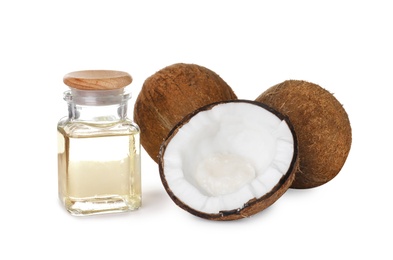 Photo of Composition with bottle of natural organic oil, ripe coconuts and butter isolated on white