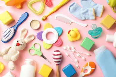 Photo of Flat lay composition with baby accessories on color background