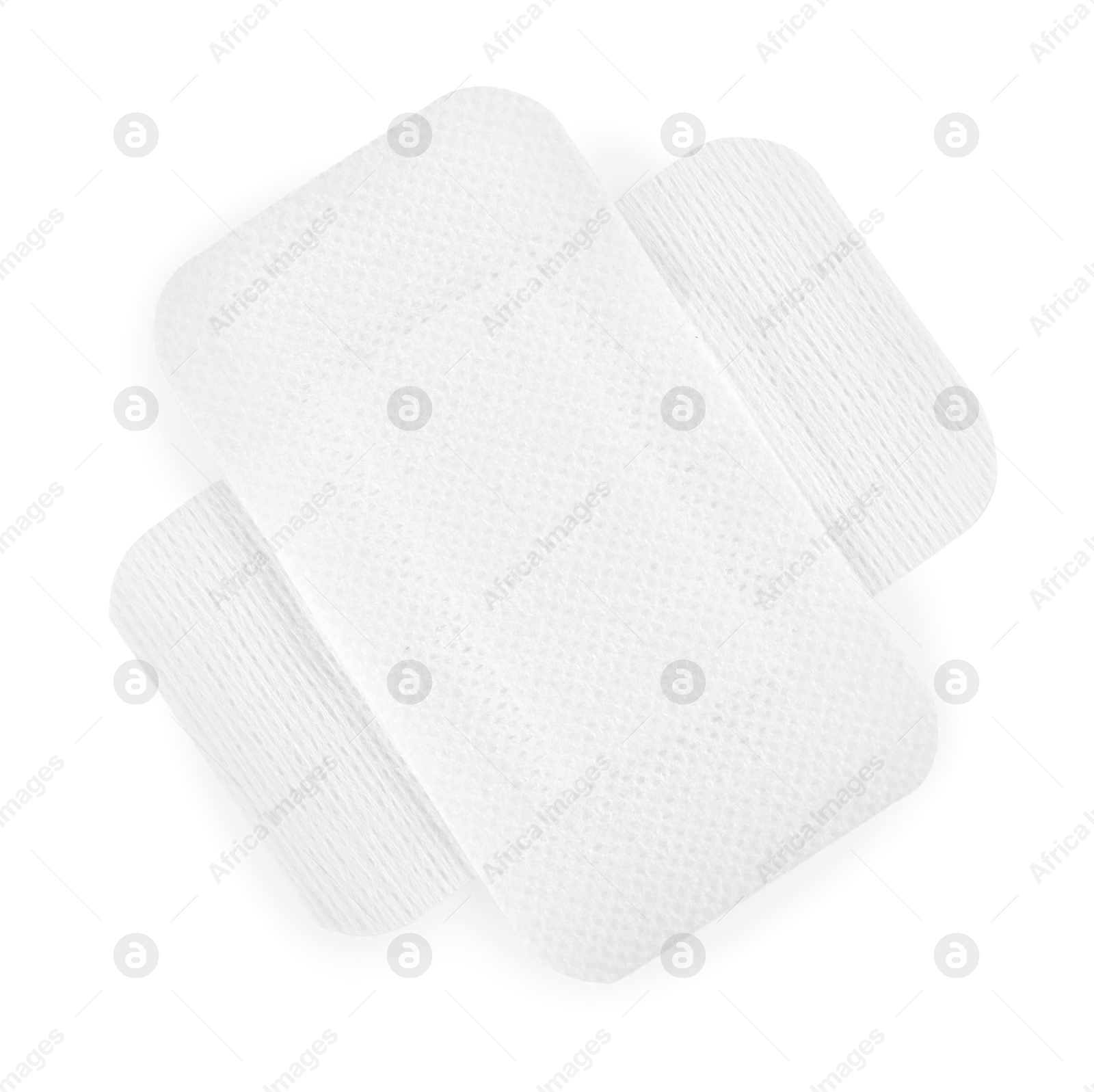 Photo of Medical adhesive bandages isolated on white, top view