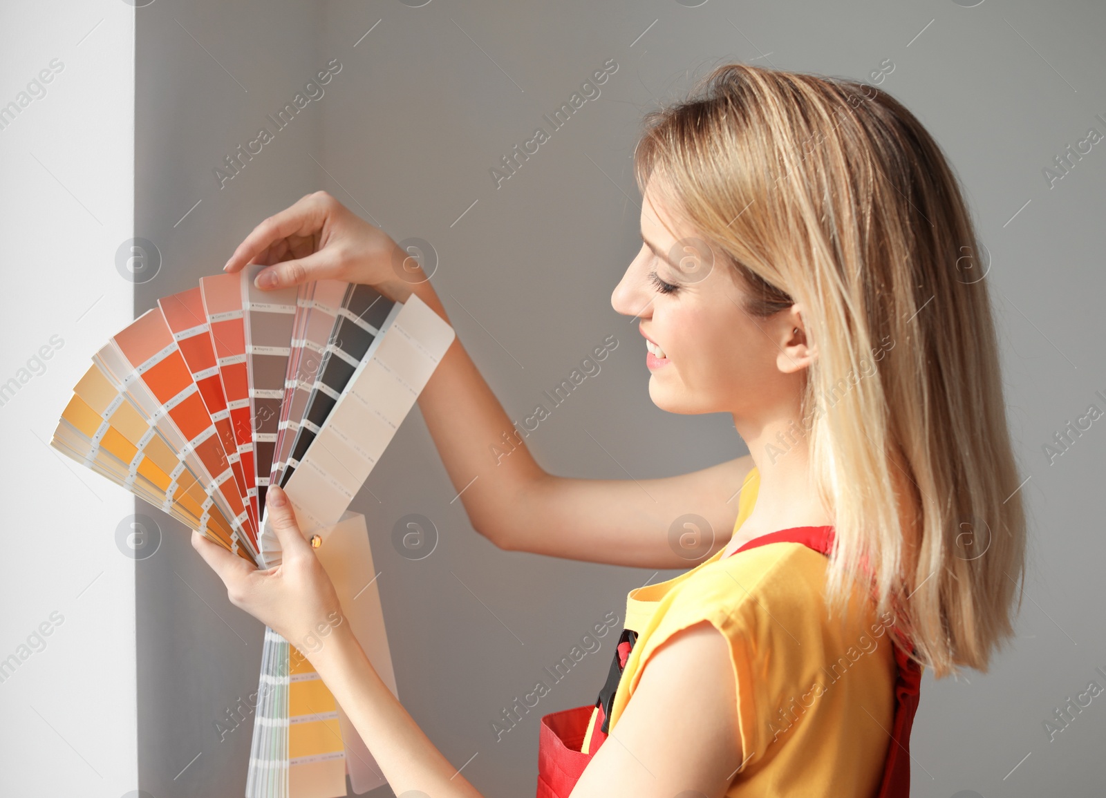 Photo of Female decorator with color palette indoors