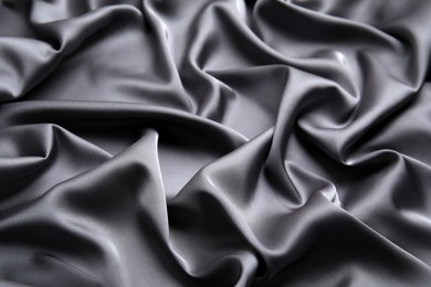 Photo of Texture of delicate black silk as background, closeup