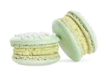 Photo of Beautifully decorated Christmas macarons on white background