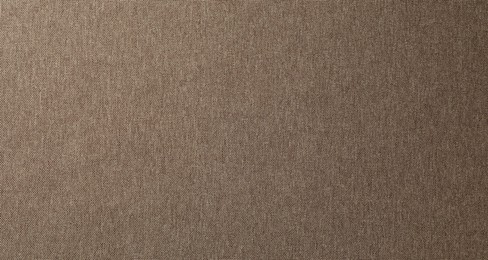 Photo of Texture of brown fabric as background, top view