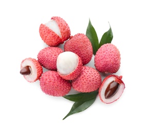 Photo of Pile of fresh ripe lychees with green leaves on white background, top view