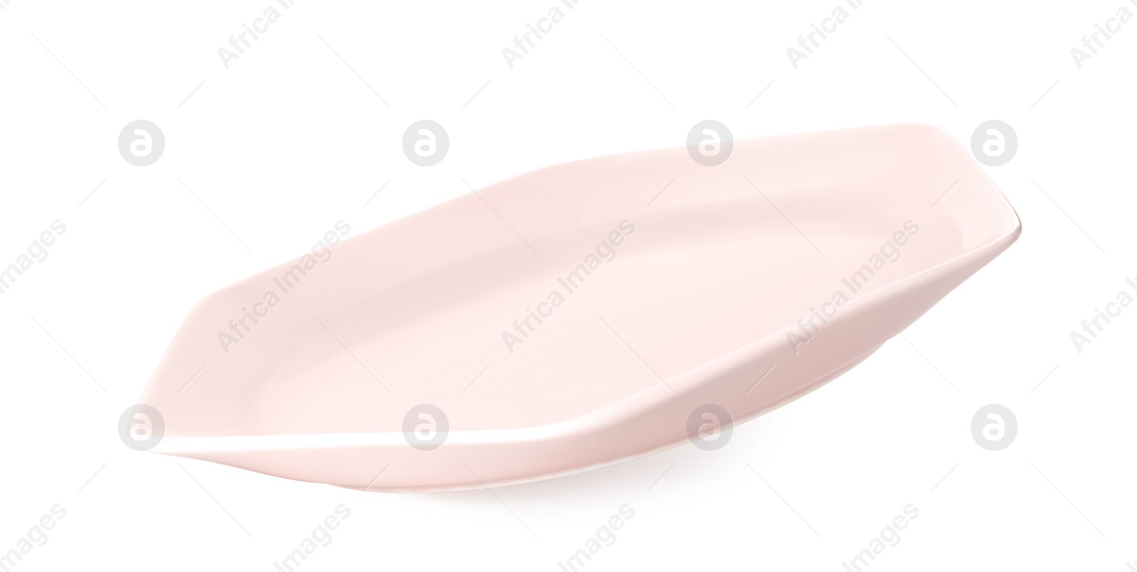 Photo of Clean light pink plate isolated on white
