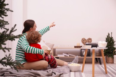 Family watching movie via video projector at home