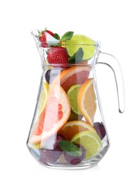 Photo of Glass jug with different whole and cut fruits on white background
