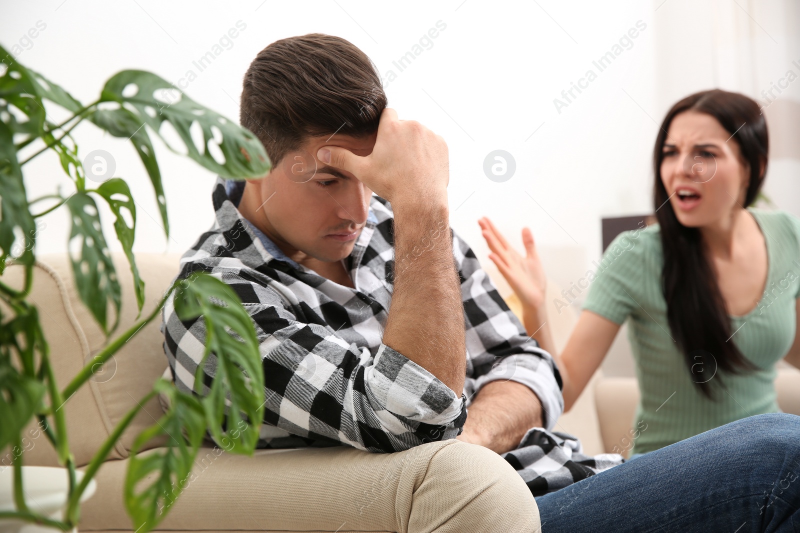 Photo of Couple having quarrel at home. Relationship problems