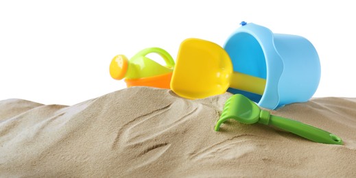 Photo of Plastic toy set with shovel on pile of sand