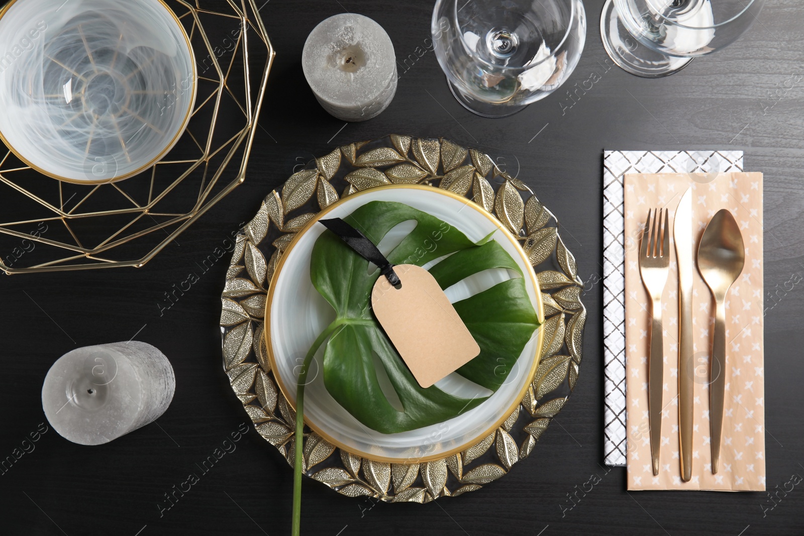 Photo of Elegant table setting on dark background, top view