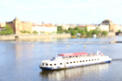 PRAGUE, CZECH REPUBLIC - APRIL 25, 2019: Blurred cityscape with Vltava river
