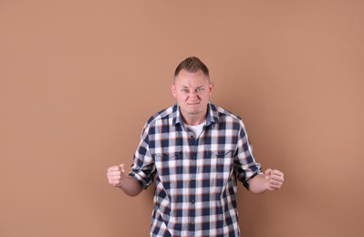 Portrait of handsome man on color background