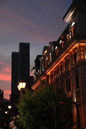 Photo of BATUMI, GEORGIA - MAY 31, 2022: Beautiful cityscape with streetlights and illuminated building in evening