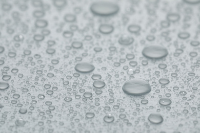 Water drops on white background, closeup view