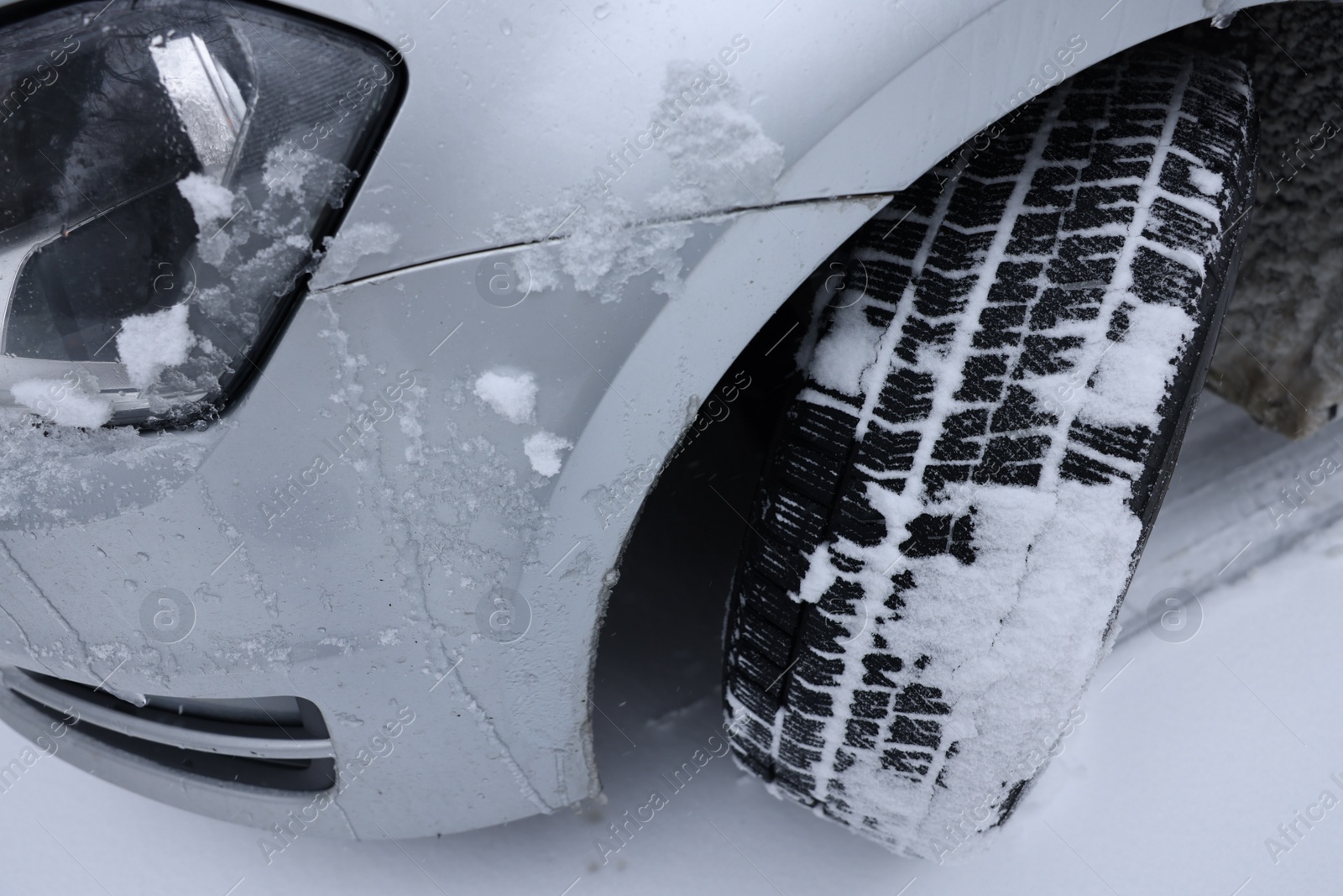 Photo of Car with winter tires on snowy road