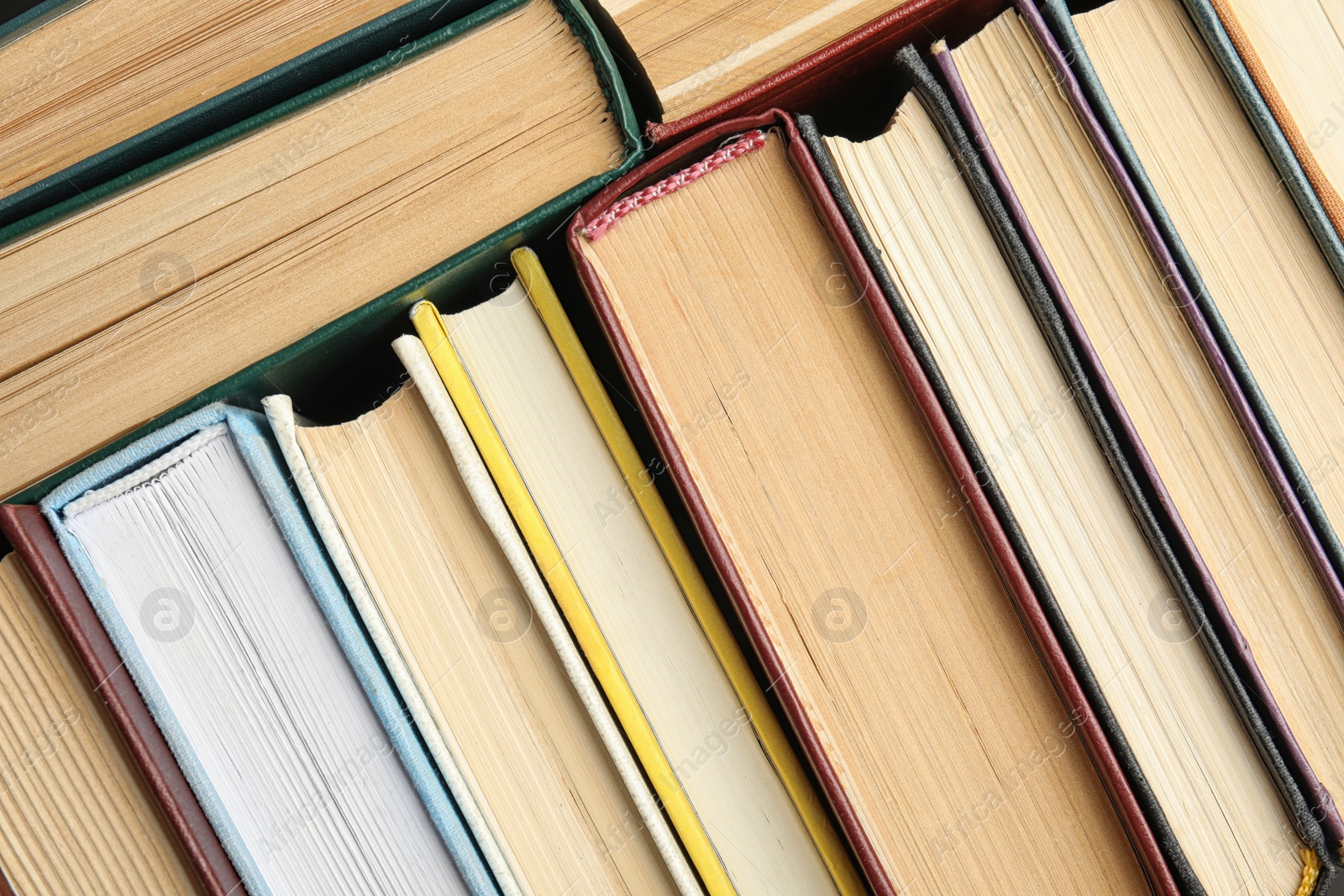 Photo of Many different hardcover books as background, top view