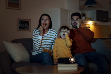 Photo of Emotional family watching movie using video projector at home