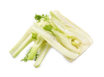 Photo of Cut raw fennel bulbs isolated on white