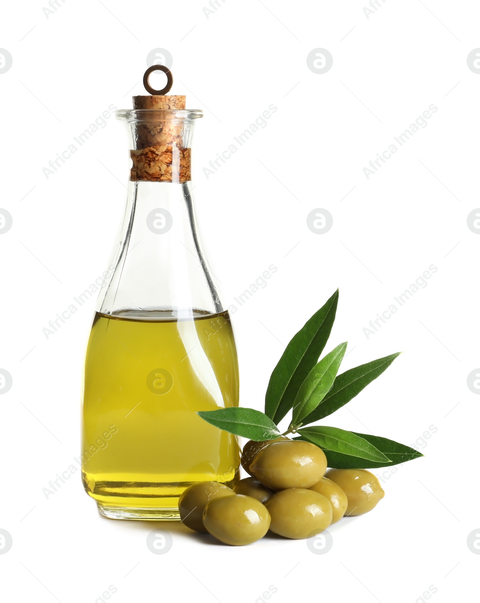 Photo of Glass bottle with fresh olive oil on white background