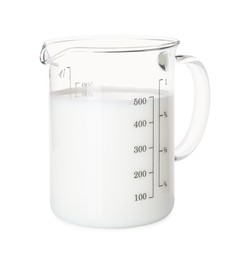 Photo of Fresh milk in measuring cup isolated on white