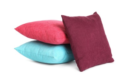 Different colorful decorative pillows on white background