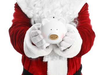 Santa Claus holding piggy bank on white background, closeup