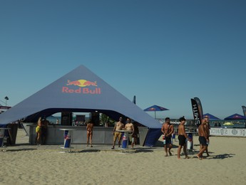 SENIGALLIA, ITALY - JULY 22, 2022: Red Bull tent on beach under blue sky