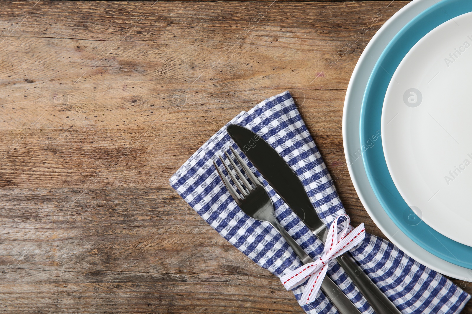 Photo of Beautiful table setting on wooden background, flat lay. Space for text