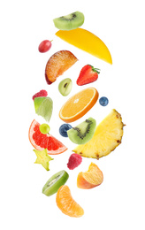 Image of Fresh tasty fruits and berries falling on white background