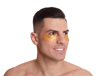 Man with golden under eye patches on white background