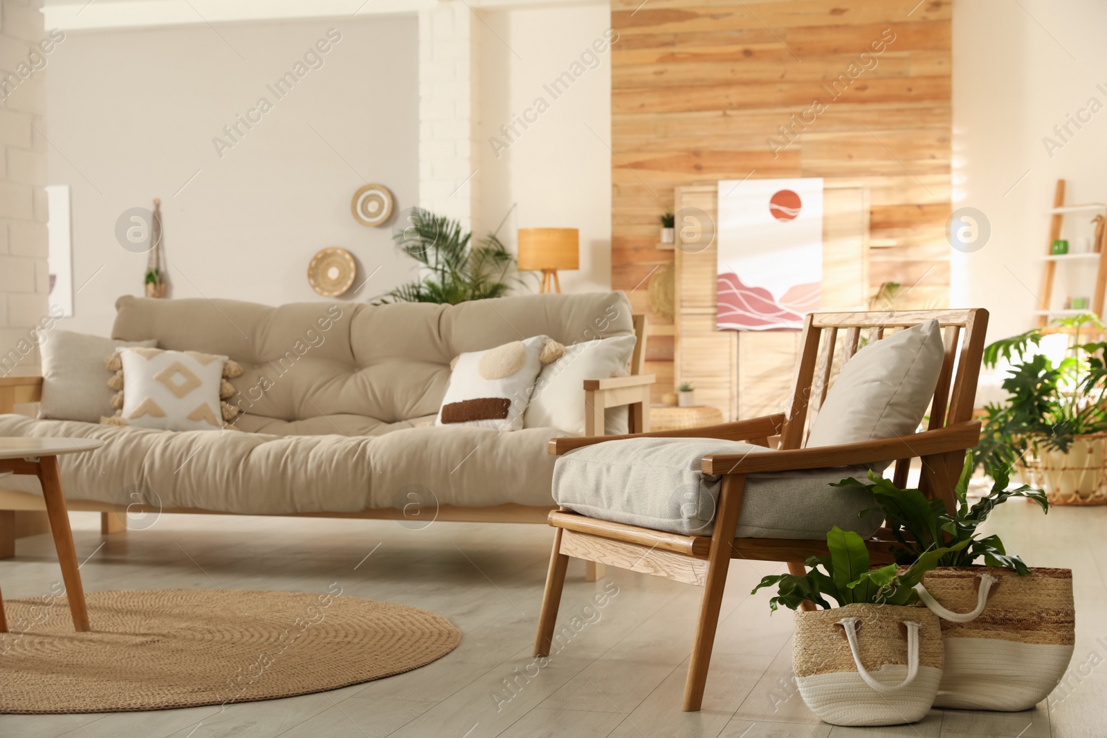 Photo of Light room interior with stylish wooden furniture. Idea for design