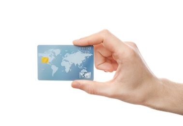 Young man holding credit card on white background