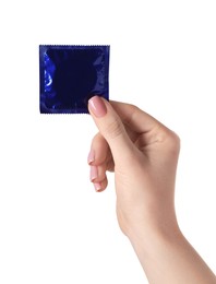 Photo of Woman holding condom on white background, closeup